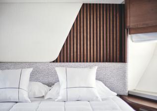 y85-interior-forward-guest-cabin-headboard-walnut-satin.jpg