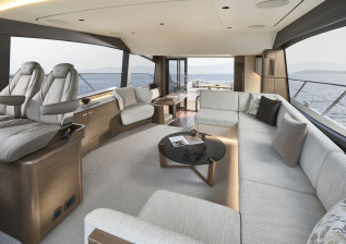 f58-interior-saloon-looking-aft-with-optional-chair-table-open-silver-oak.jpg