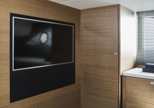 f45-interior-owners-stateroom-tv-rovere-oak-satin.jpg