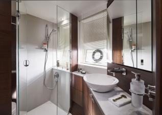 s66-interior-forward-cabin-bathroom-walnut-satin.jpg