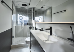 s65-interior-owners-stateroom-bathroom-silver-oak-satin.jpeg