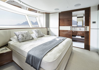 x80-interior-main-deck-owners-stateroom-en-suite-doors-partially-open.jpg